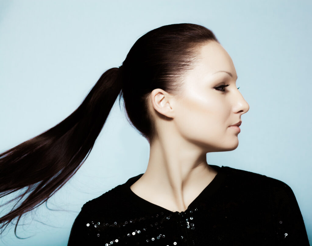 Beautiful woman, seen in side profile, smiles after her Morpheus8 treatment in Salt Lake City