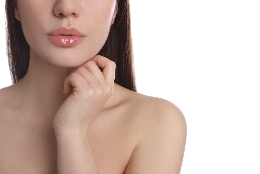 Woman with smooth, natural-looking lips after lip filler treatment
